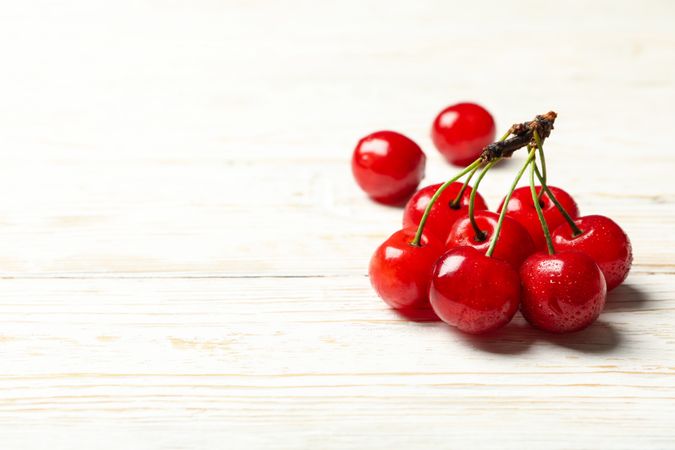 Fresh red cherry on wooden background, close up