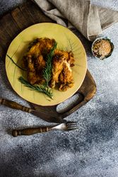Top view yellow plate of grilled chicken with rosemary