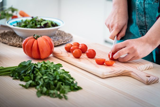Woman preparing vegetable salad