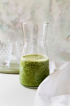 Organic Green smoothie detox drink in a glass bottle
