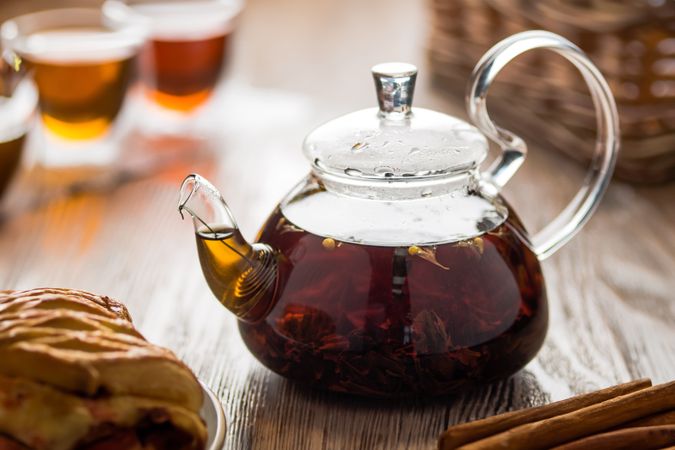 Glass Teapot with Tea and Pastries