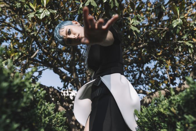 Futuristic woman reaching out camera