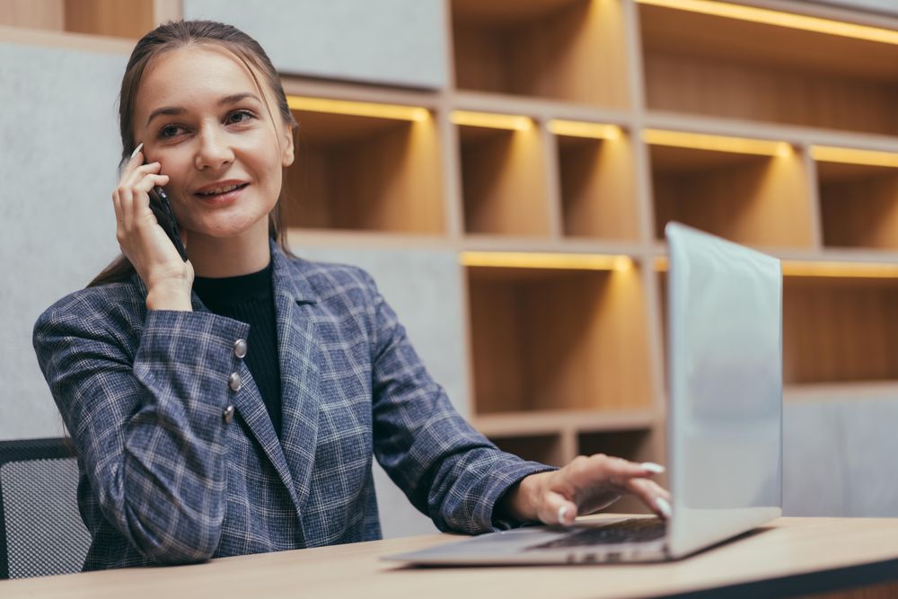 Female taking phone call in modern office