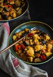 Popular Georgian summer and autumnal dish Ajapsandali with vegetables on stone background with copy space