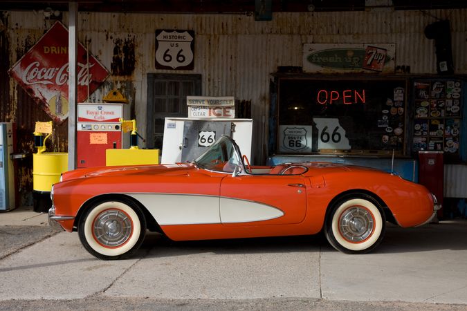 Shiny red Corvette car in vintage garage in Arizona