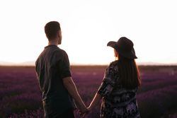 Young couple on a romantic date in a lavender field.