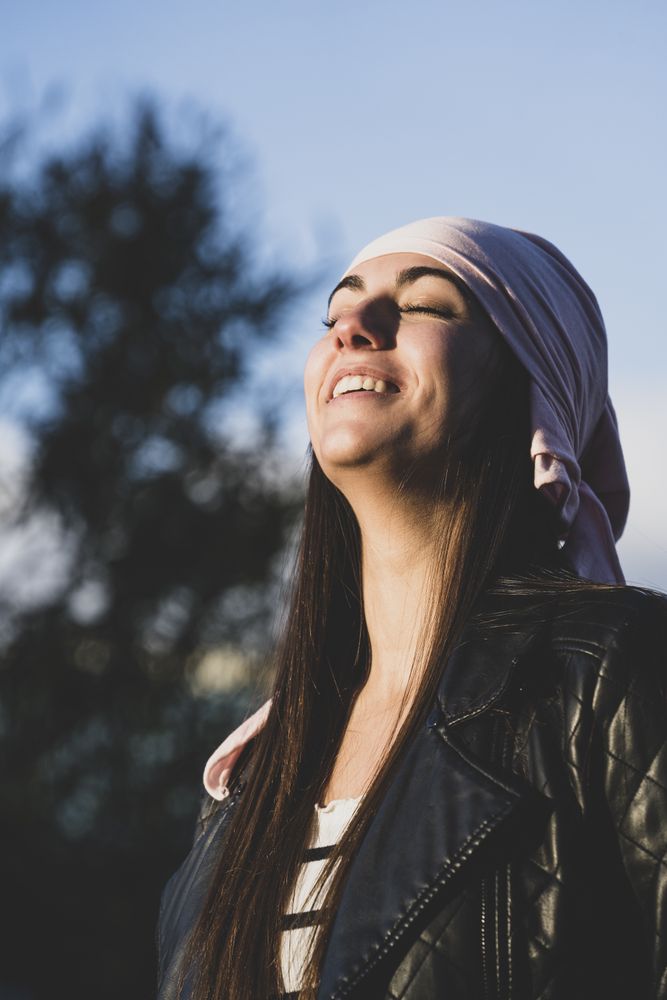 Young woman with cancer bandana