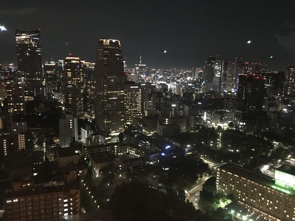 City skyline with high rise buildings during night time