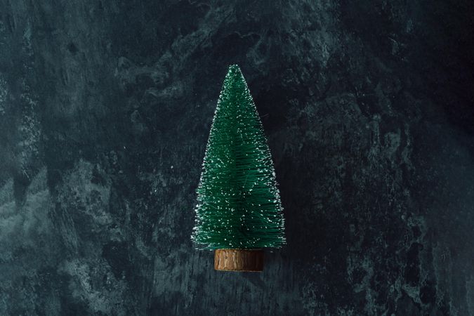 Miniature Christmas tree on dark marble table