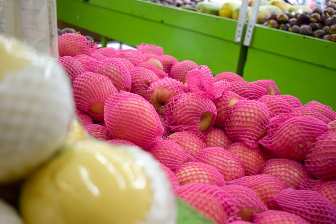 Pear fruit pack wrapped in pink and for sale in market store