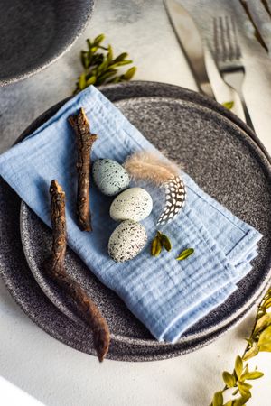 Easter table setting with eggs and branch