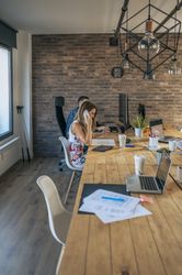 Woman talking on the mobile in an office