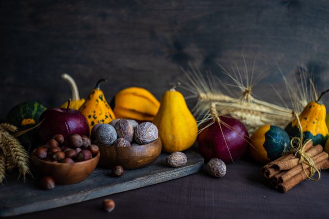 Spread of autumnal foods on wooden table