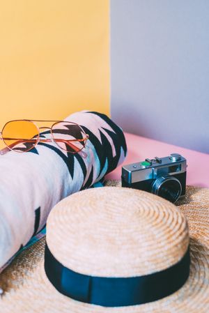 Summer trendy sunglasses, towel, hat and camera