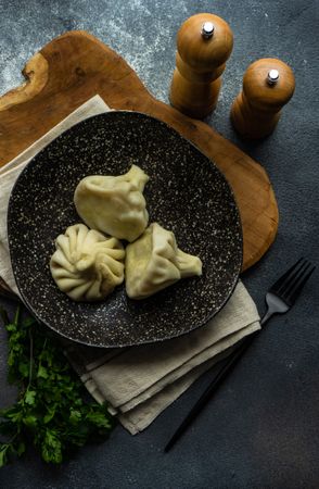 Top view of delicious Georgian khinkali dumplings served on plate