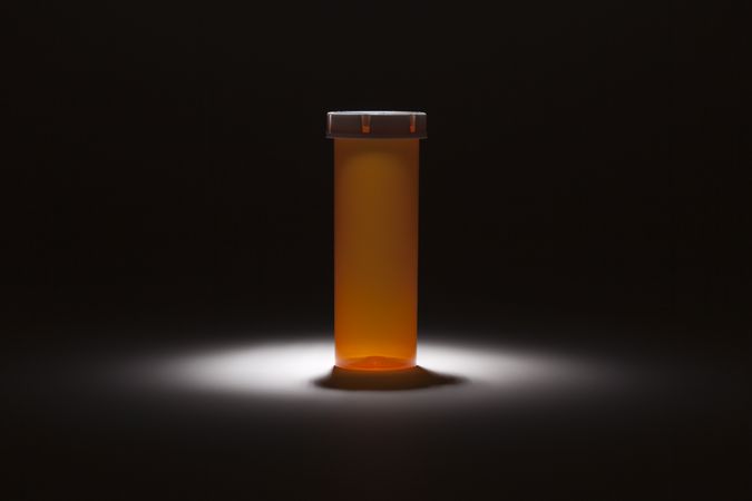 Empty Medicine Bottle Under Spot Light