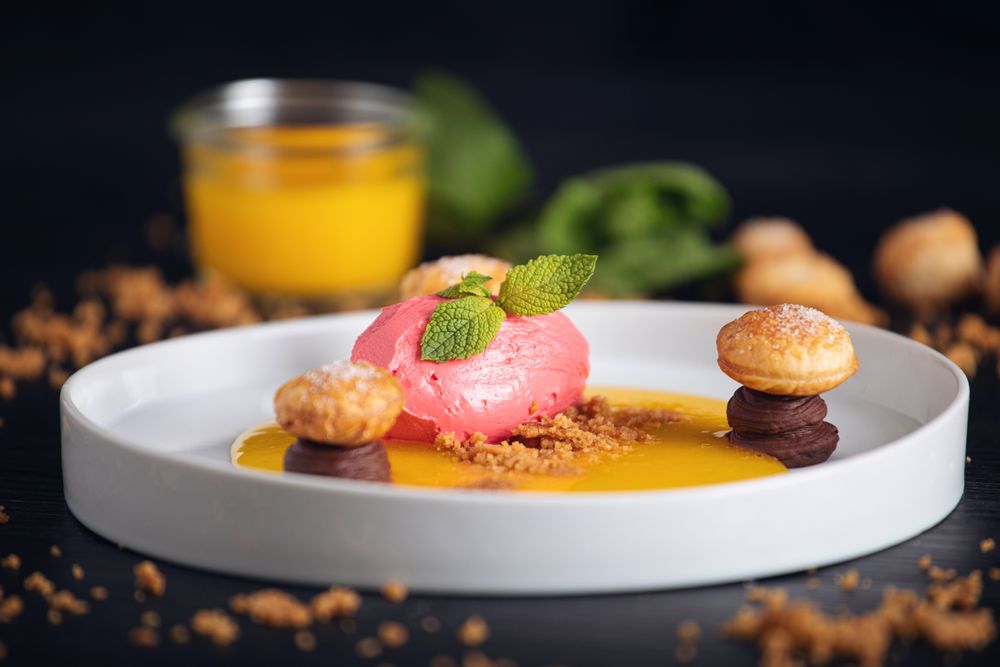 Raspberry ice cream with curable oranges chocolate and puff pastry