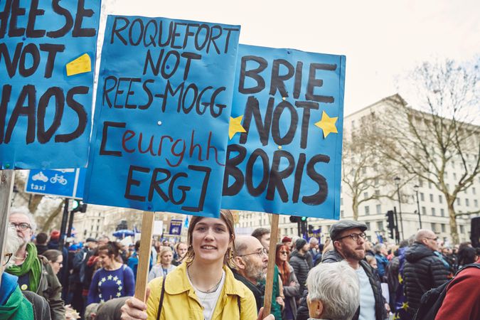 London, England, United Kingdom - March 23rd, 2019: Woman with pro-EU signs at Brexit protest