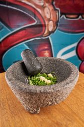 Green onion in stone mortar