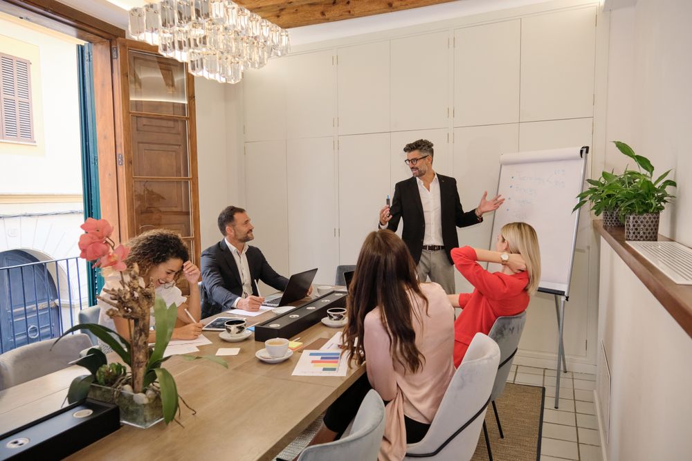 Group of business colleagues discussing project in office
