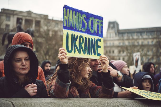 London, England, United Kingdom - March 5 2022: Woman with “hands off Ukraine” sign