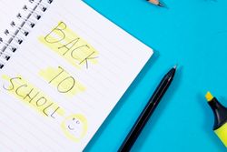 Notebook with writing Back to School with green stabilo