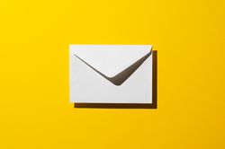 One light envelope over yellow background