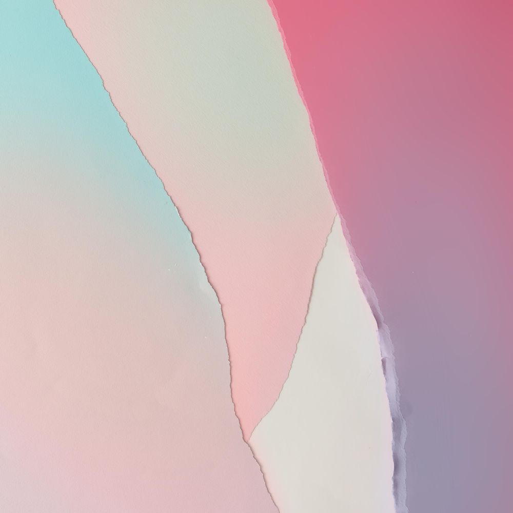 Pieces of ripped pastel colored paper in pattern