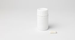 Mockup of a bottle of B12 vitamins in capsules, closed, with copyspace
