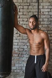 Confident Black boxer in gym