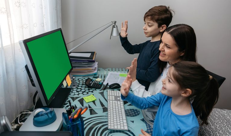 Family waving on video call