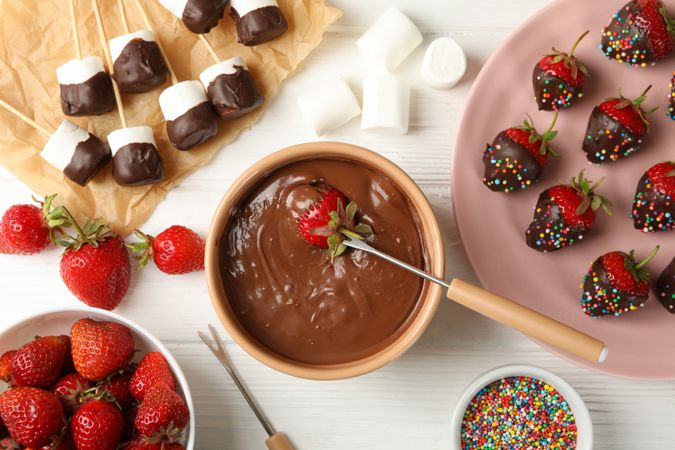 Composition with strawberry and marshmallow in chocolate, top view. Chocolate fondue