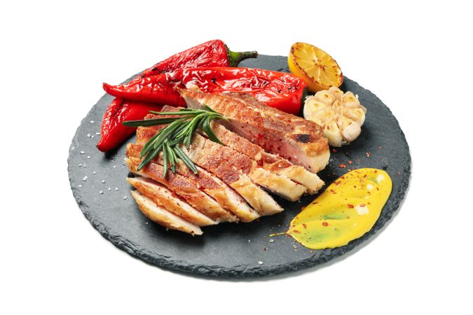 Tray with chopped pork steak isolated on light background