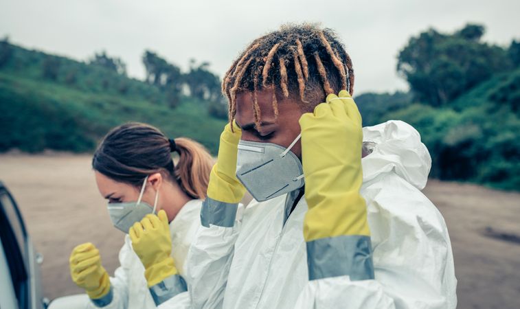 Young people putting on protective masks
