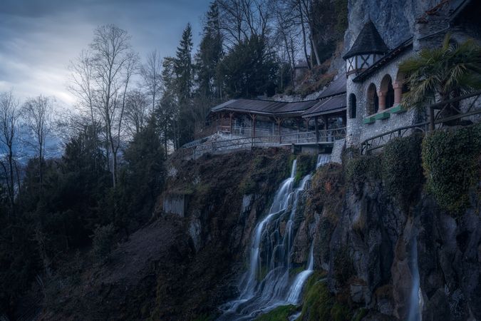 Picturesque waterfall on high cliff