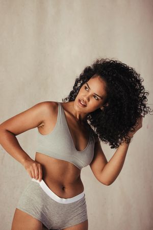 Attractive young woman feeling confident in her natural body
