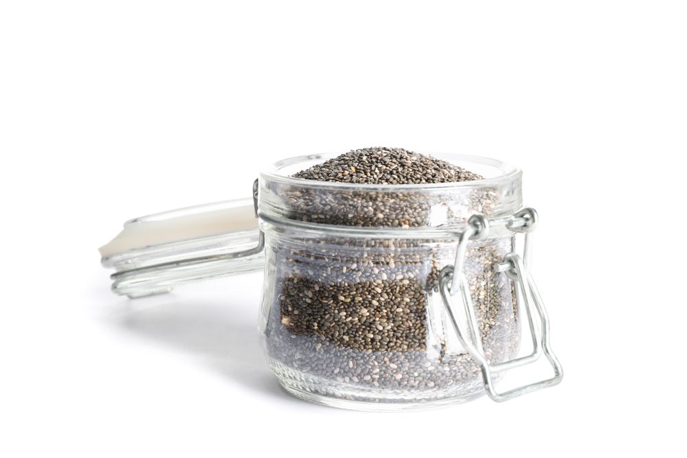 Chia seeds in glass jar isolated on plain background
