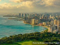 Cityscape of Honolulu by shoreline at sunset in Hawaii 5QXxe0