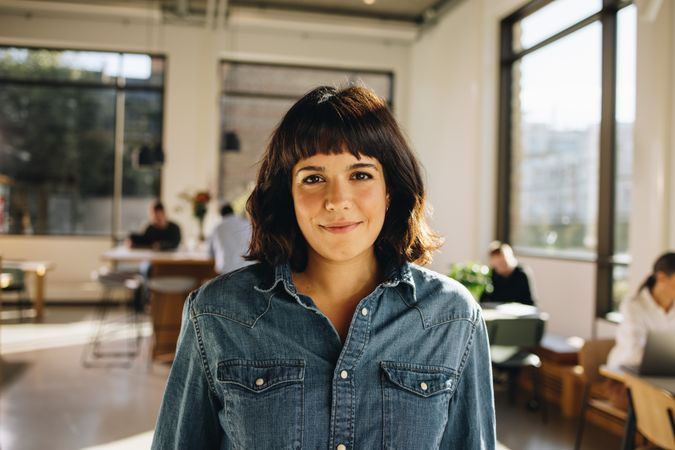 Confident businesswoman in co-working space