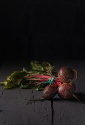 Bunch of raw beetroot with edible taproots and leaves