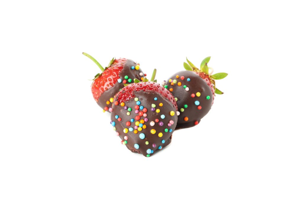 Chocolate fondue. Strawberry in chocolate isolated on plain background