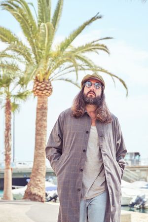 Trendy man walking in port