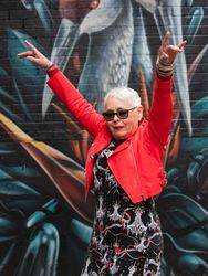 Mature woman in red leather jacket