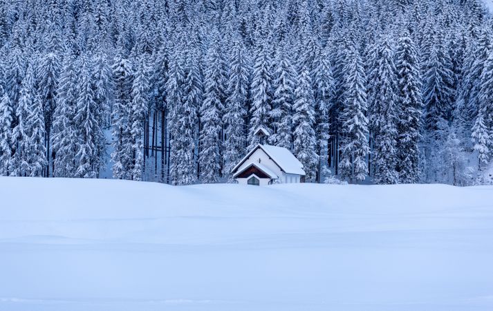 Church minimalist in a deep snow nature, winter scenery in the Bavarian Alps, Germany