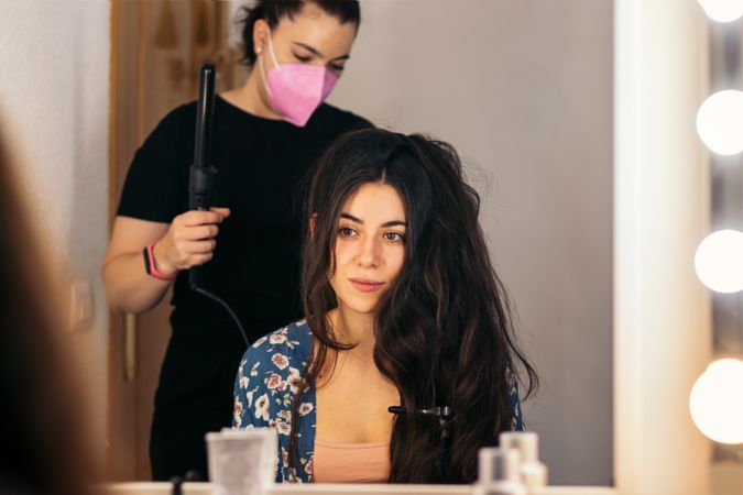 Hairdresser doing a woman's long hair