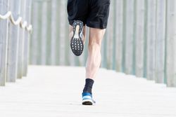 Sportsman jogging outdoors under cover