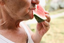 Close up Shot of an Mature Man Eating Healthy.