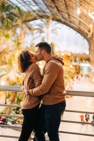 Happy couple hugging in pavilion