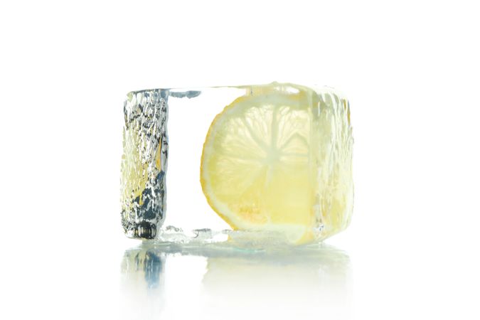 Single ice cube with lemon slice