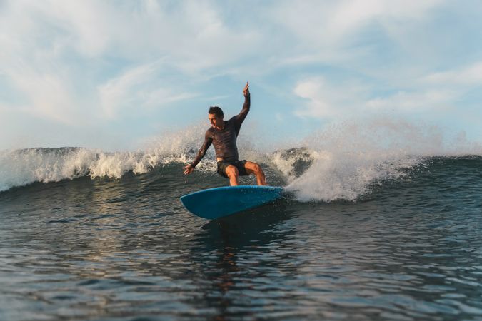 Man on surf board on waving water